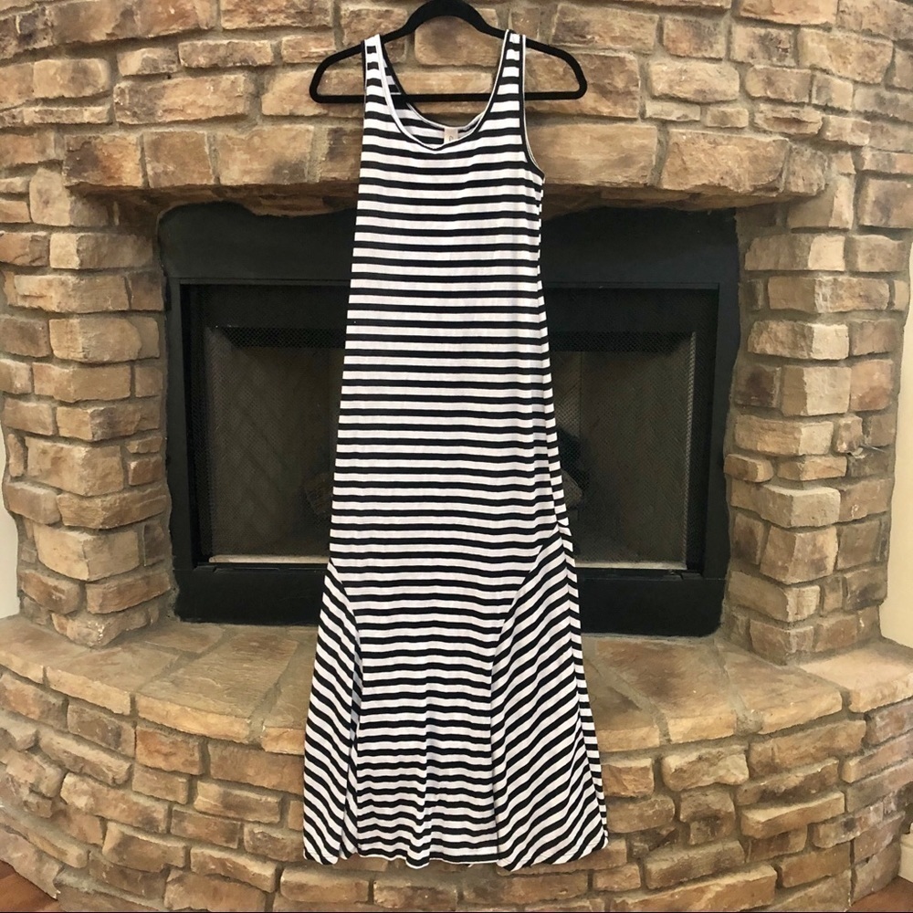 Eunishop black and white striped maxi dress with flared bottom.  Medium